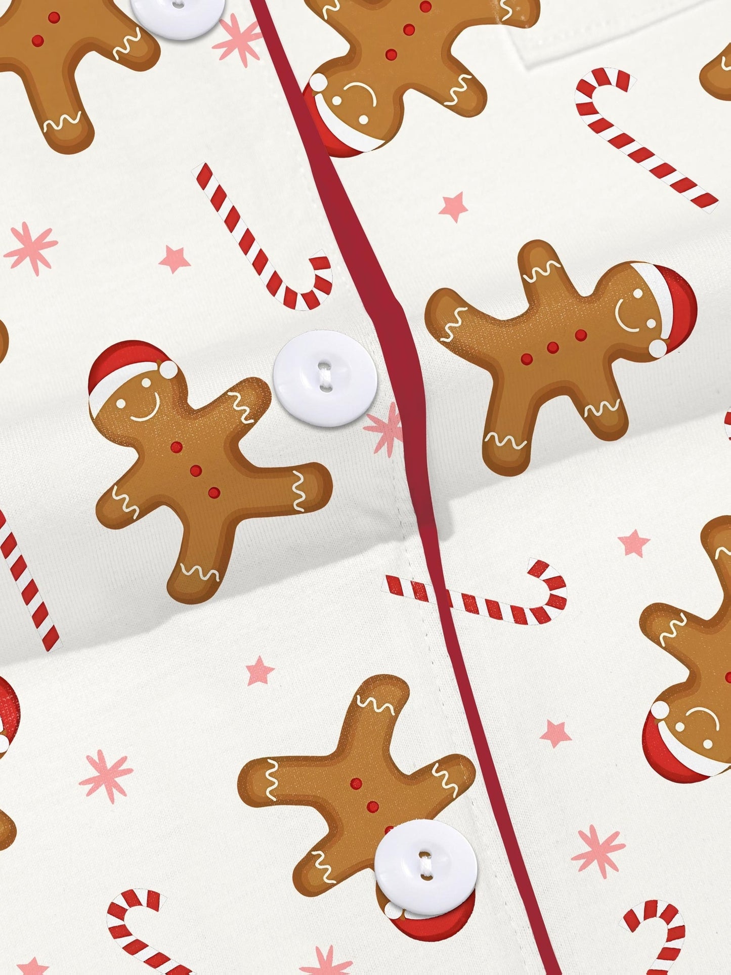 Pink holiday modal pajama set with gingerbread, candy cane and Santa print — short sleeve button top and elastic waist shorts with piping