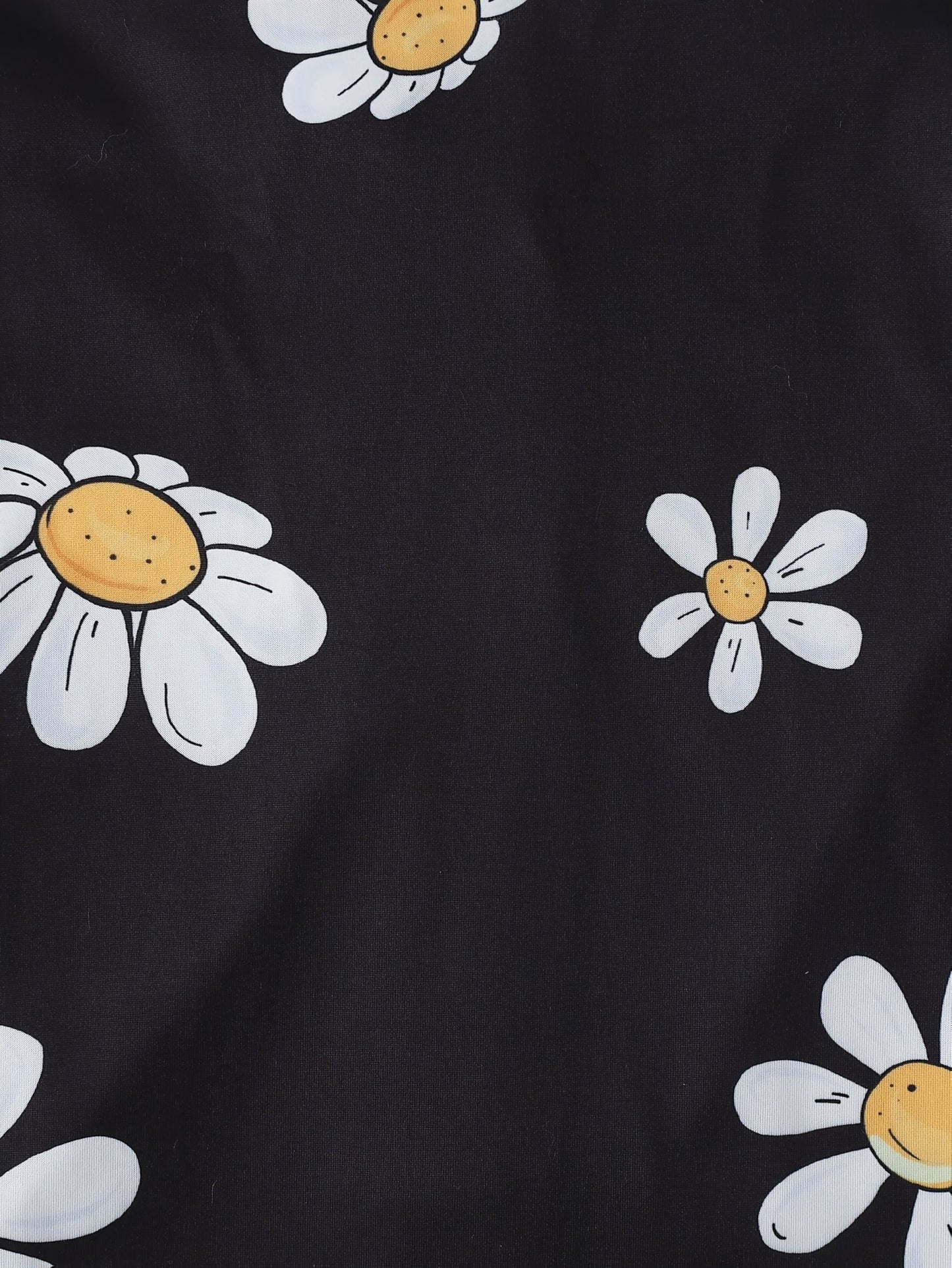 Black satin-look short-sleeve pajama set with white daisy print, piped trim, chest pocket and elastic waist shorts in 95% Polyester 5% Elastane — silky stretch loungewear