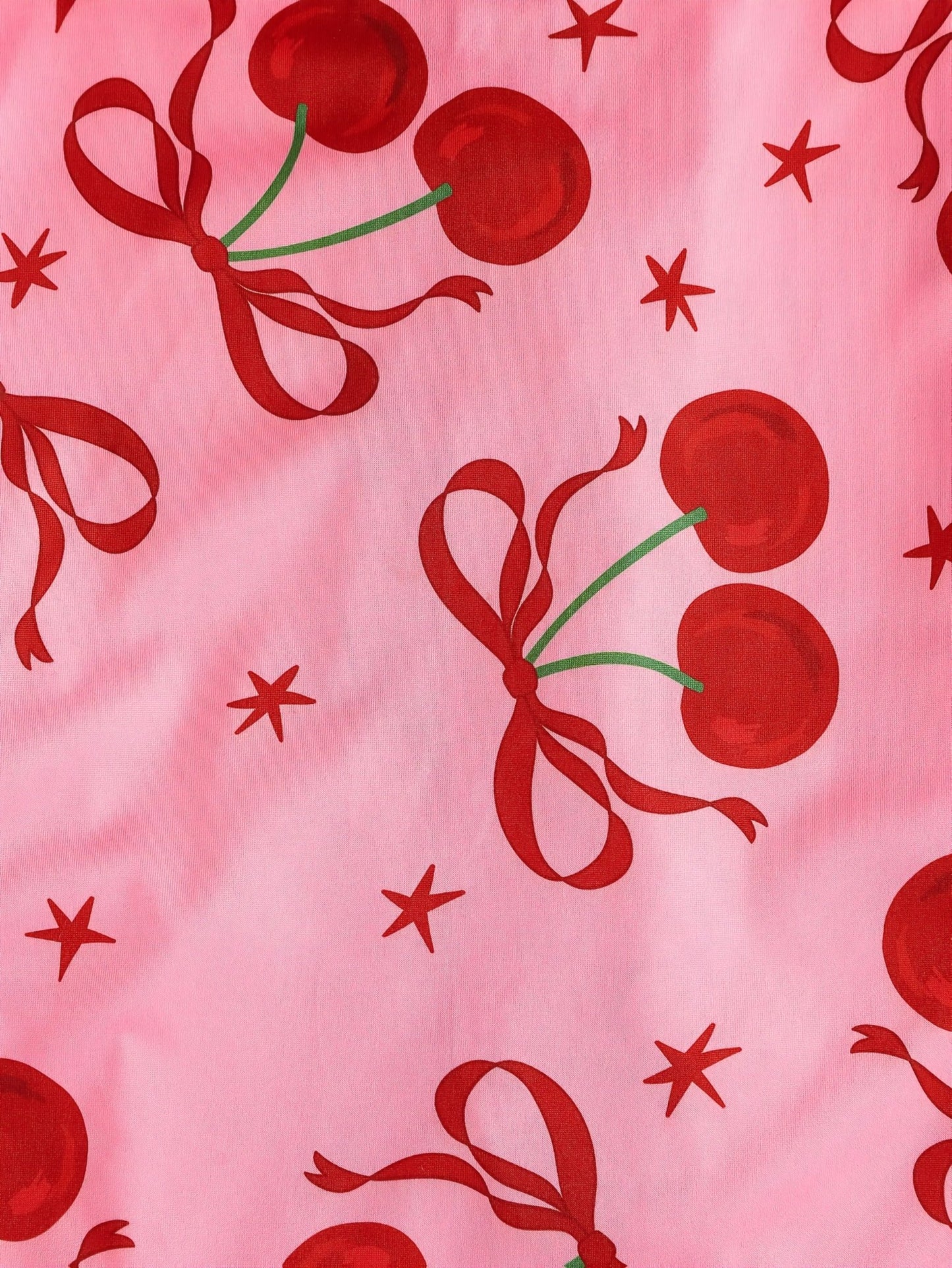 Pink satin-look short-sleeve pajama set with red cherry and bow print, piped trim, chest pocket and elastic waist shorts in 95% Polyester 5% Elastane