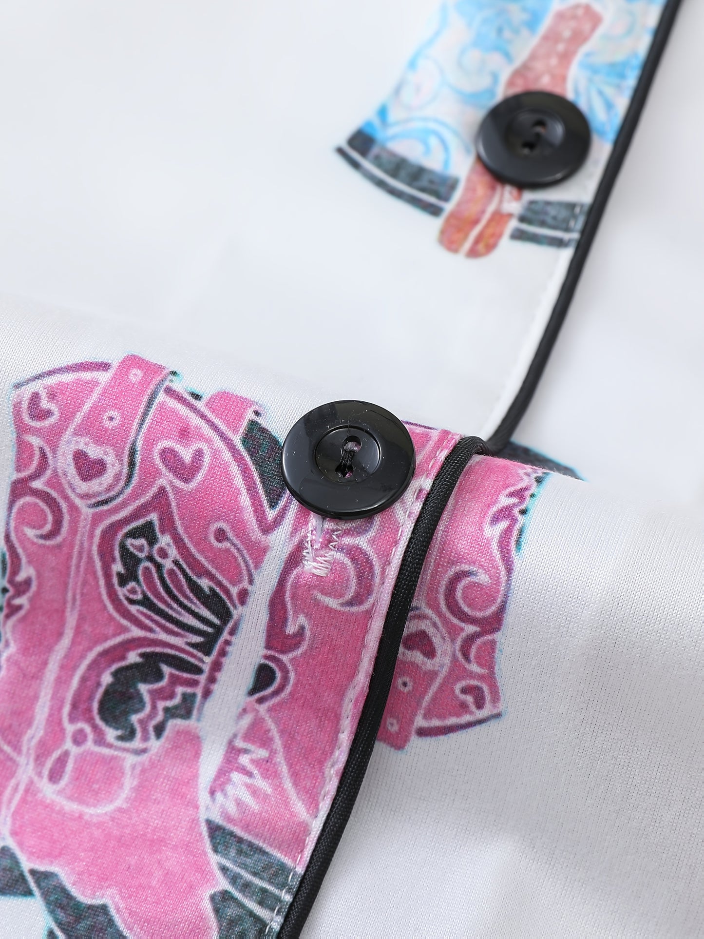 Silk‑touch modal short‑sleeve pajama top and elastic waist shorts with contrast piping and pastel print