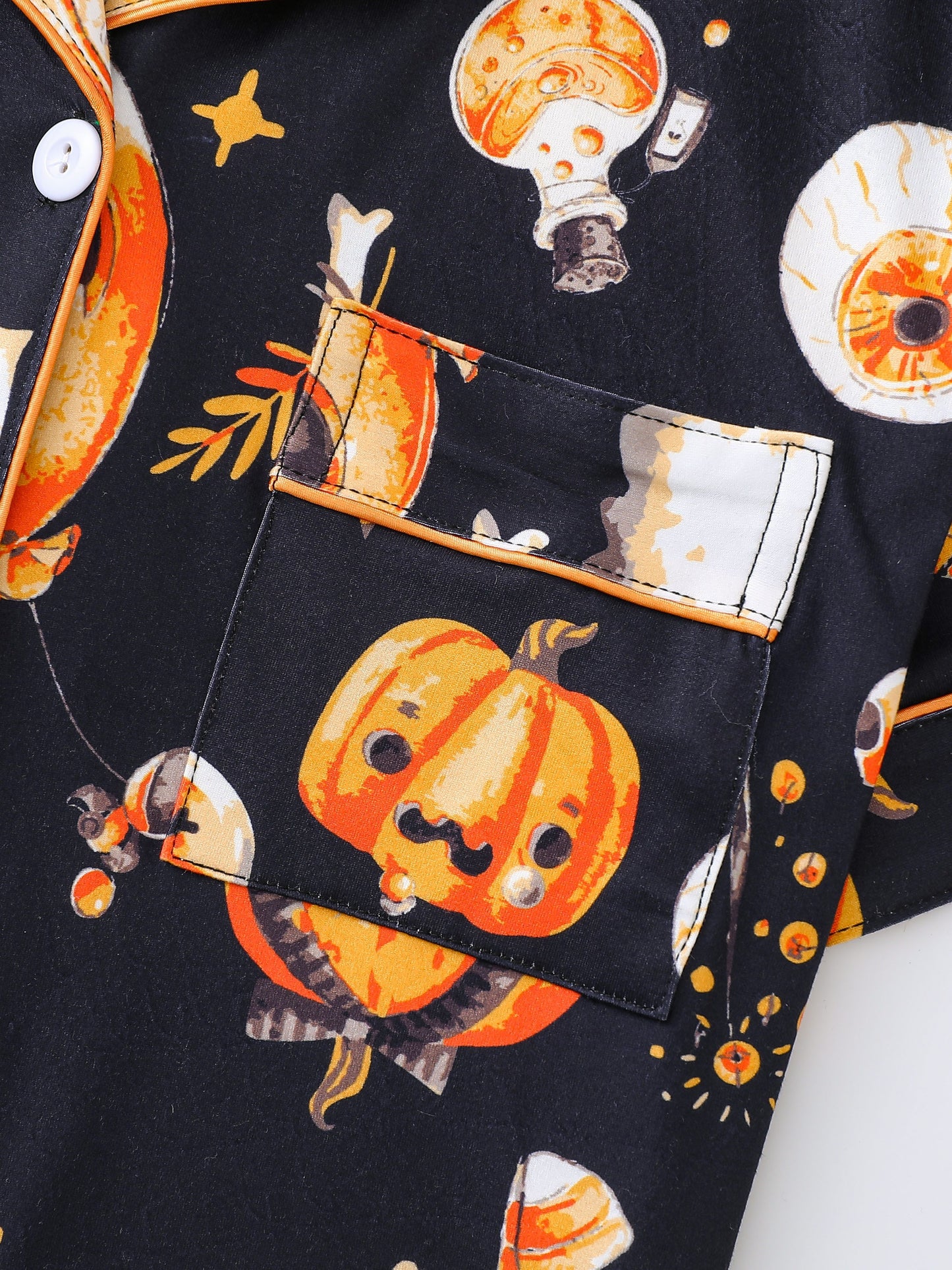 Midnight satin-look pajama set with orange pumpkin, ghost and candy print — short-sleeve button-up top with chest pocket and elastic waist shorts, 95% Polyester/5% Elastane