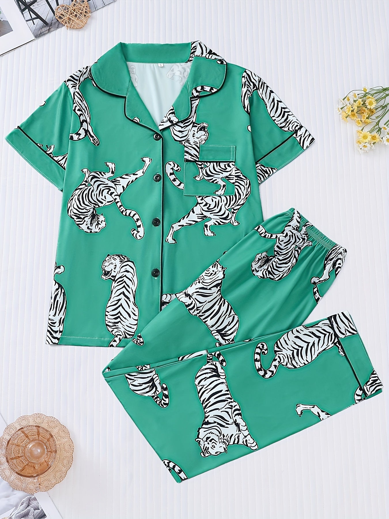 Silk‑touch modal short‑sleeve pajama top and elastic waist shorts with contrast piping and playful print