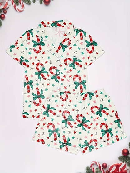 Cream cotton pajama set with candy‑cane and green bow print — short‑sleeve button top and elastic waist shorts with piping