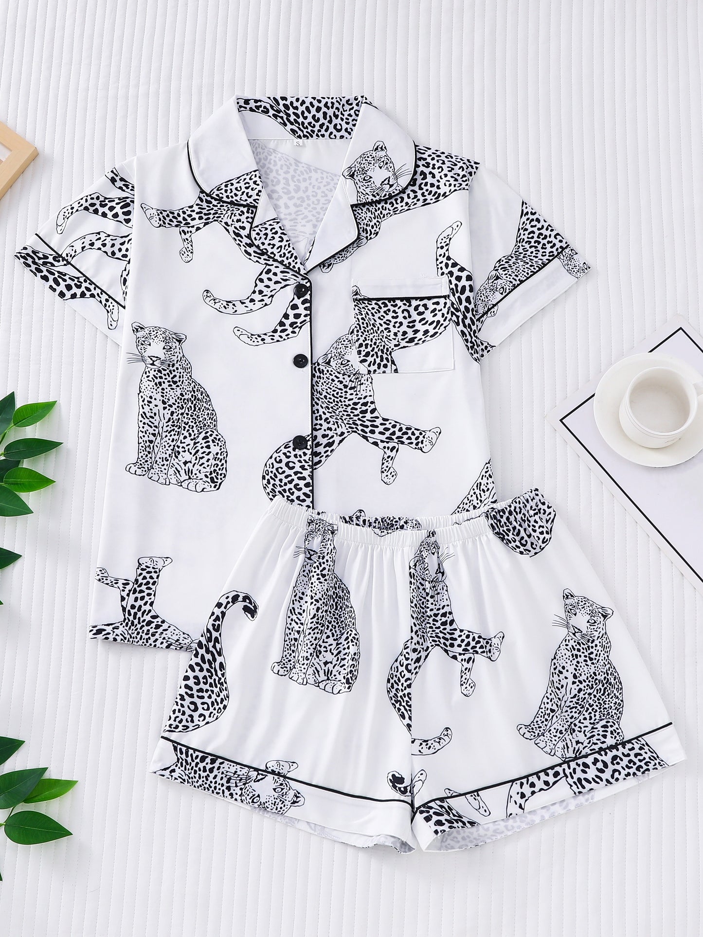 Satin-look pajama set with tiger print — short sleeve button-up top and elastic waist shorts in silky stretch fabric