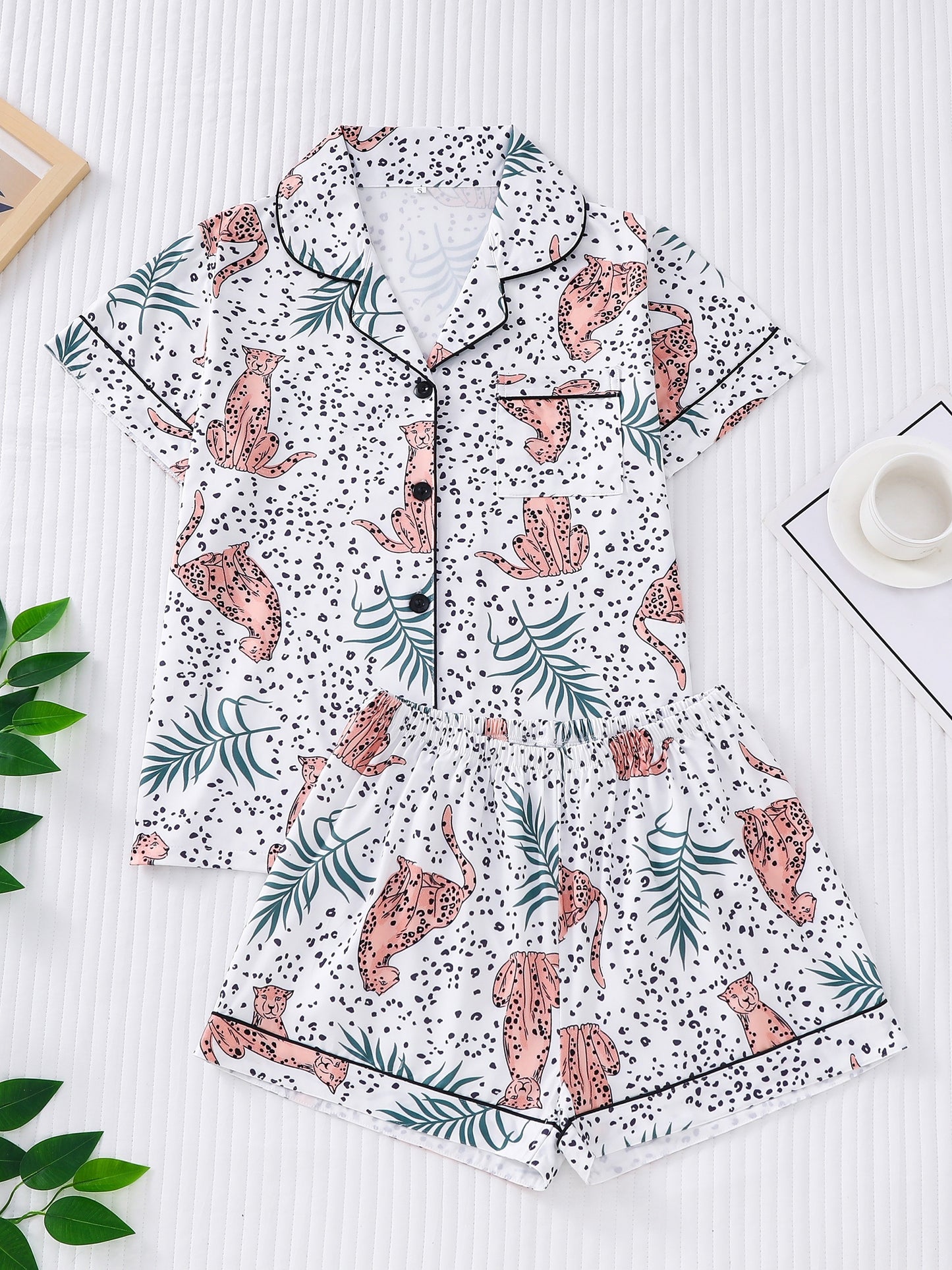 Satin-look pajama set with tiger print — short sleeve button-up top and elastic waist shorts in silky stretch fabric