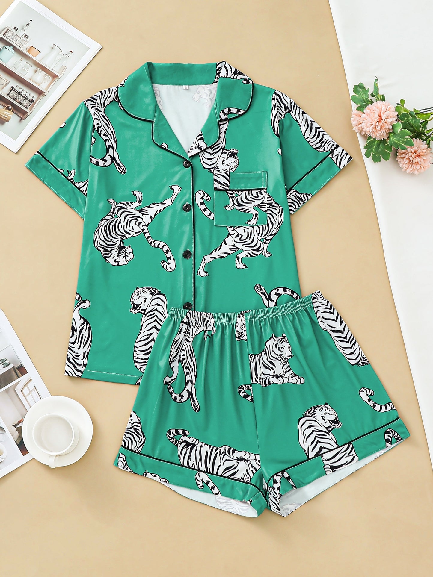 Satin-look pajama set with tiger print — short sleeve button-up top and elastic waist shorts in silky stretch fabric