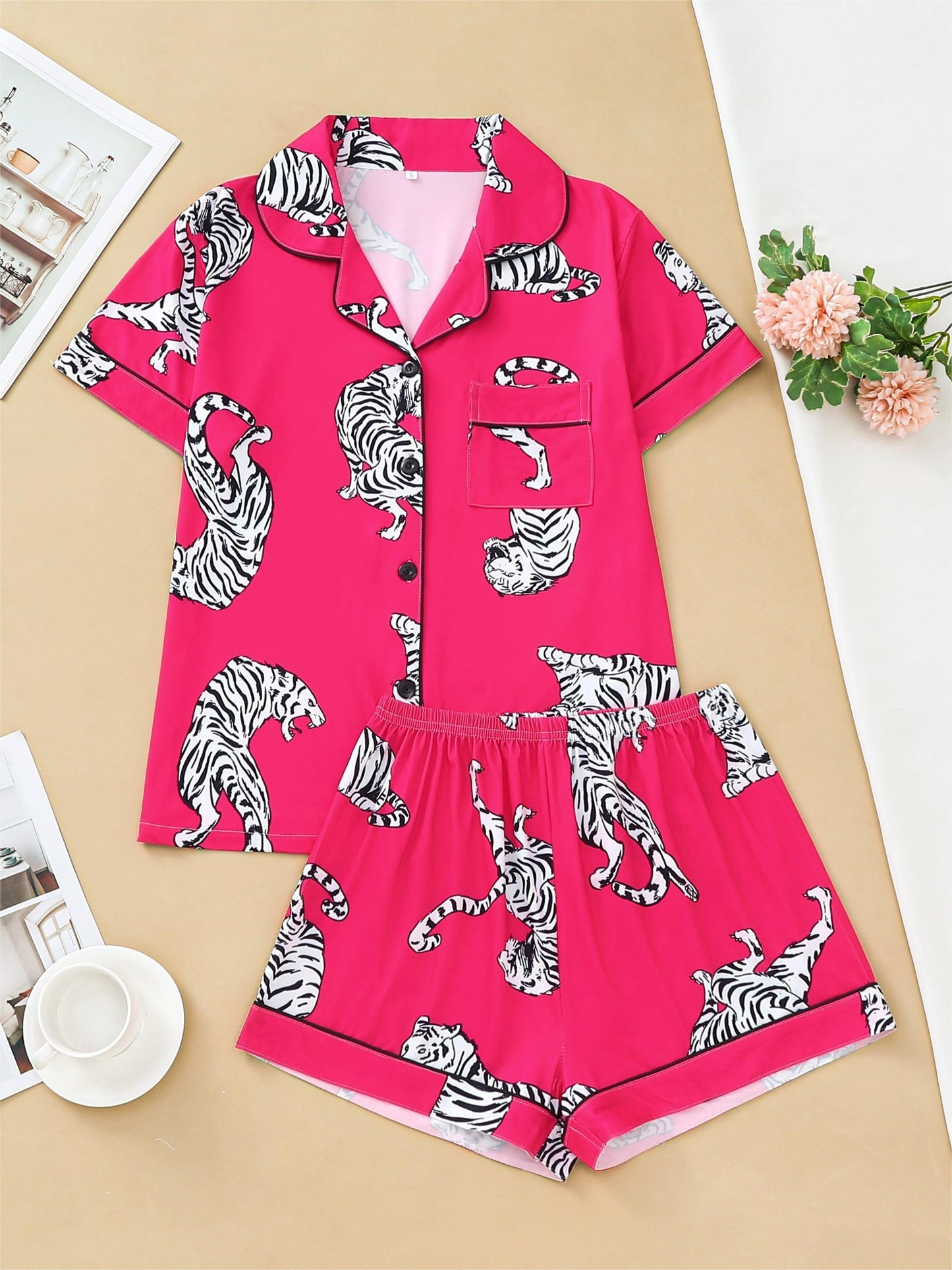 Satin-look pajama set with tiger print — short sleeve button-up top and elastic waist shorts in silky stretch fabric