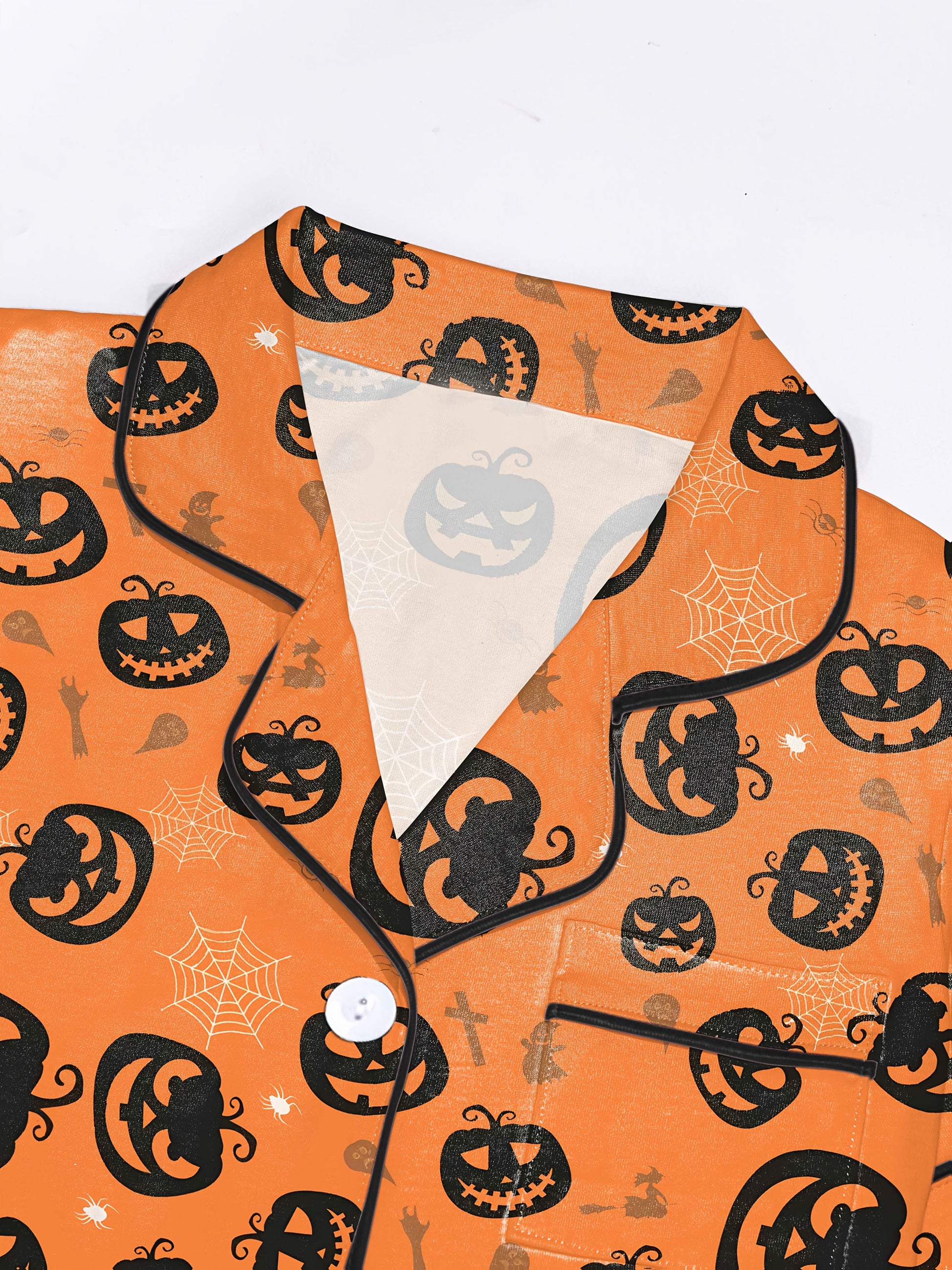 Warm pumpkin modal short‑sleeve pajama set with jack‑o‑lantern and spiderweb print — button top and elastic waist shorts with black piping