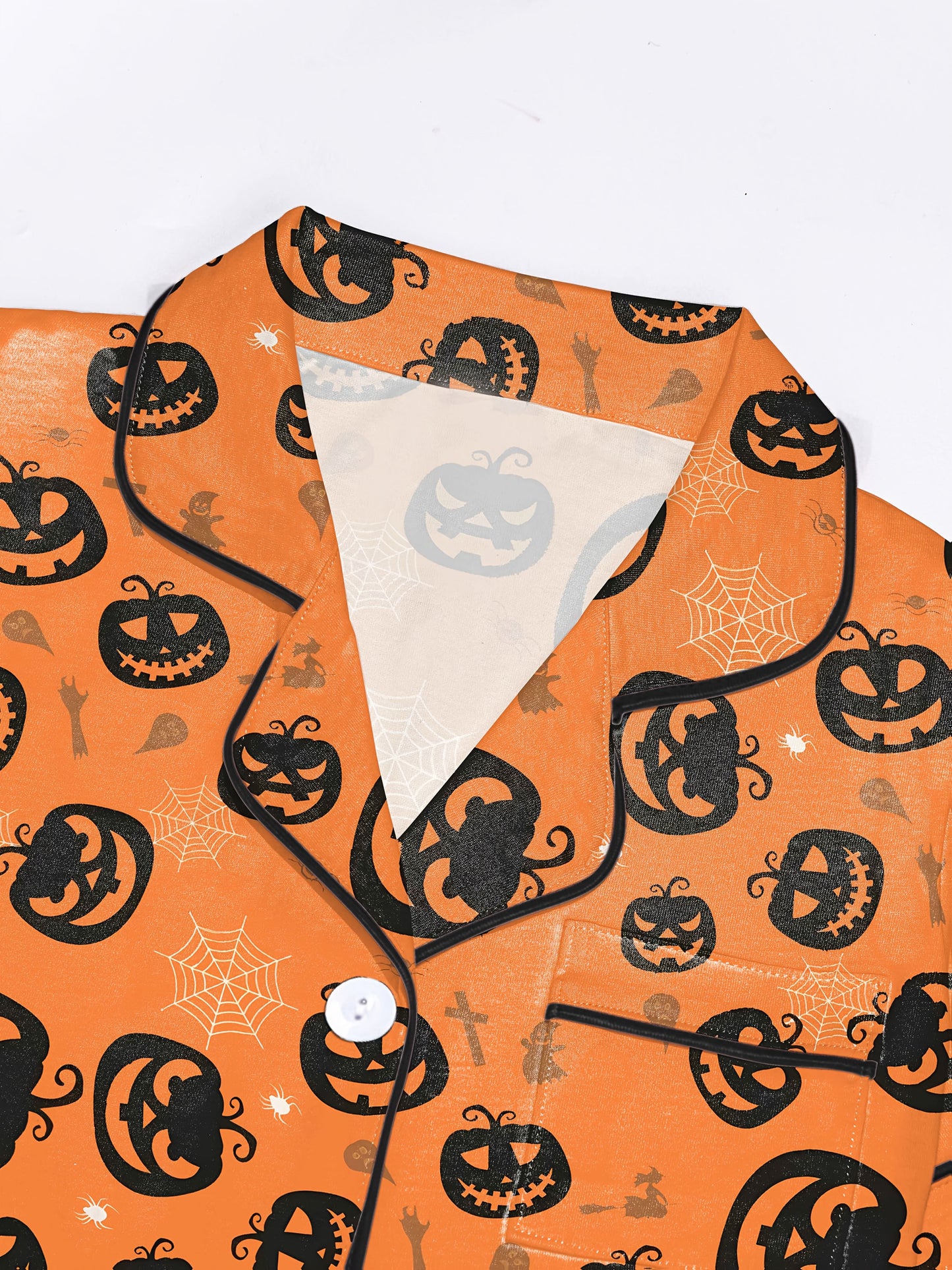 Warm pumpkin modal short‑sleeve pajama set with jack‑o‑lantern and spiderweb print — button top and elastic waist shorts with black piping