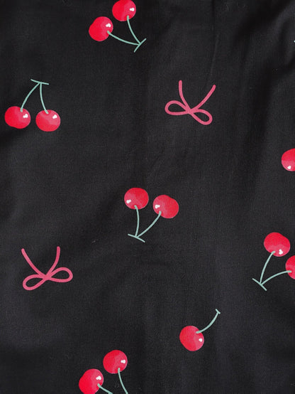 Black satin-look short-sleeve pajama set with red cherry print, piped trim, chest pocket and elastic waist shorts in 95% Polyester 5% Elastane