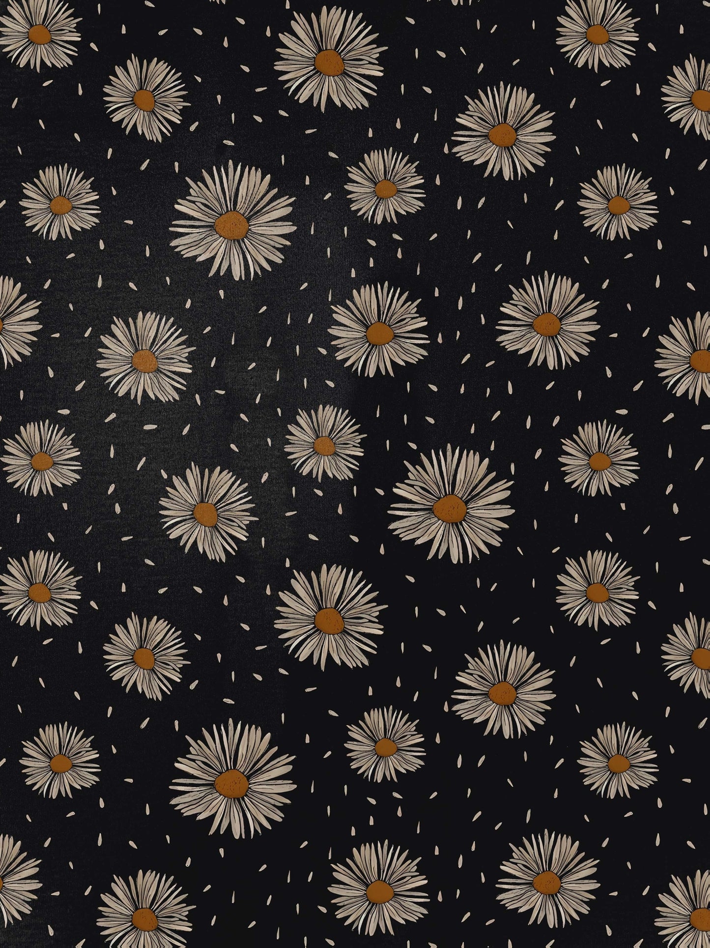 Black short-sleeve modal pajama set with cream daisy print — button-up top and elastic waist shorts with white piping