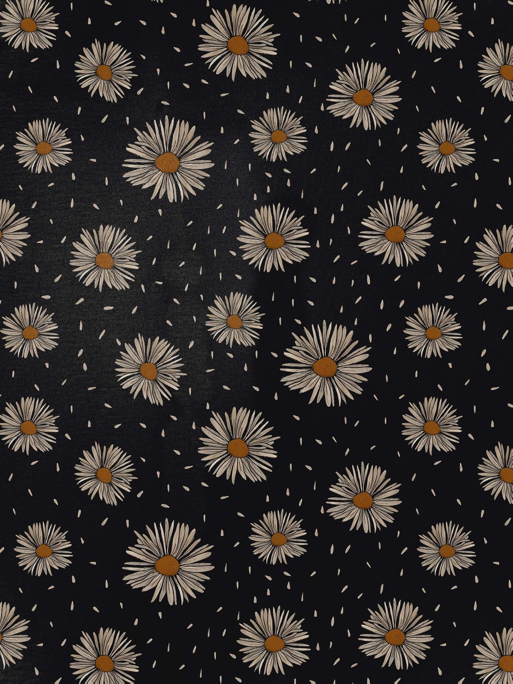 Black short-sleeve modal pajama set with cream daisy print — button-up top and elastic waist shorts with white piping