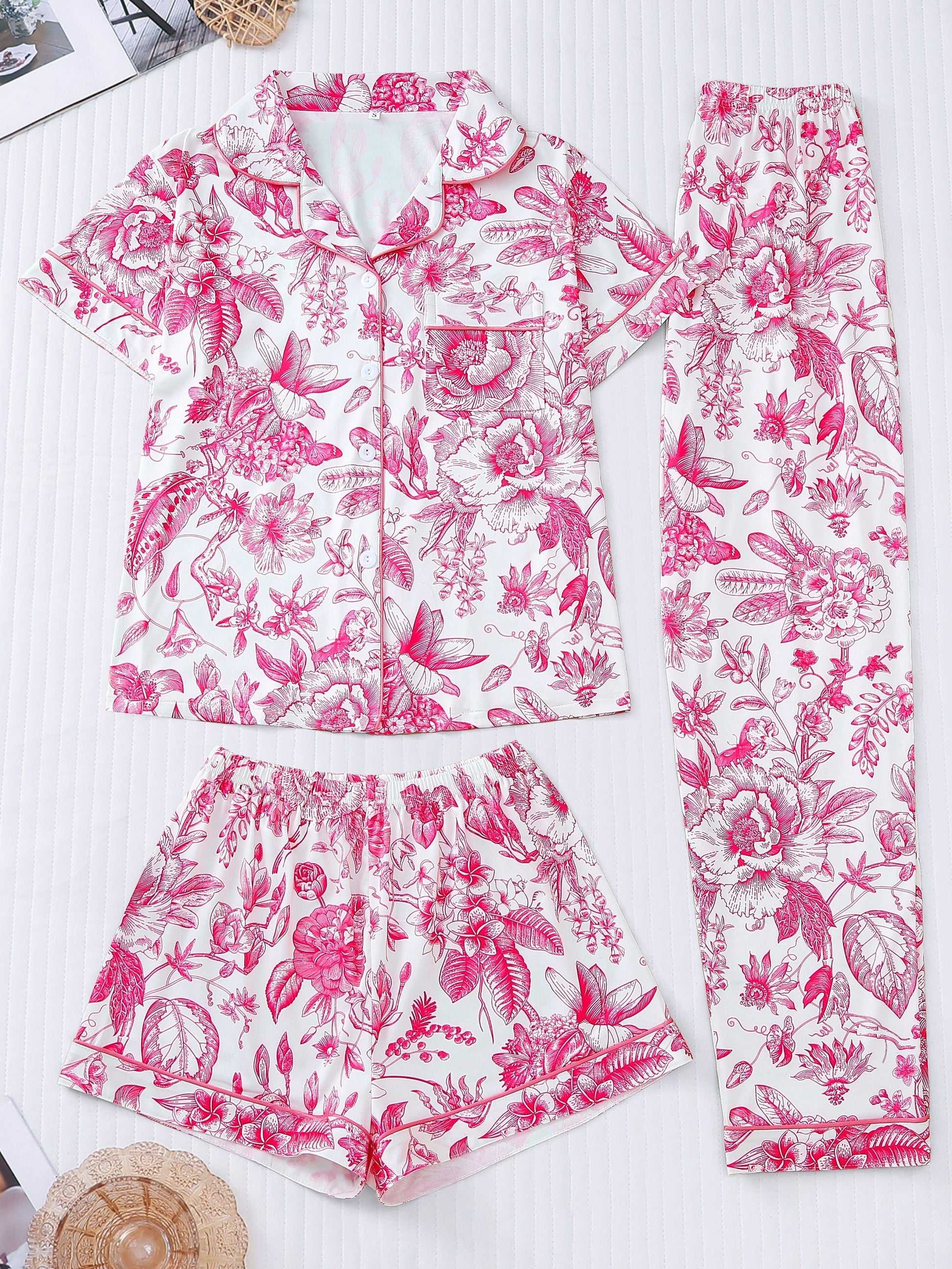 White silk‑touch modal short‑sleeve pajama top and elastic waist shorts with pink toile floral print and tonal piping