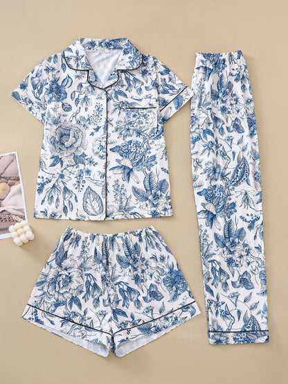 White silk‑touch modal short‑sleeve pajama top and elastic waist shorts with pink toile floral print and tonal piping