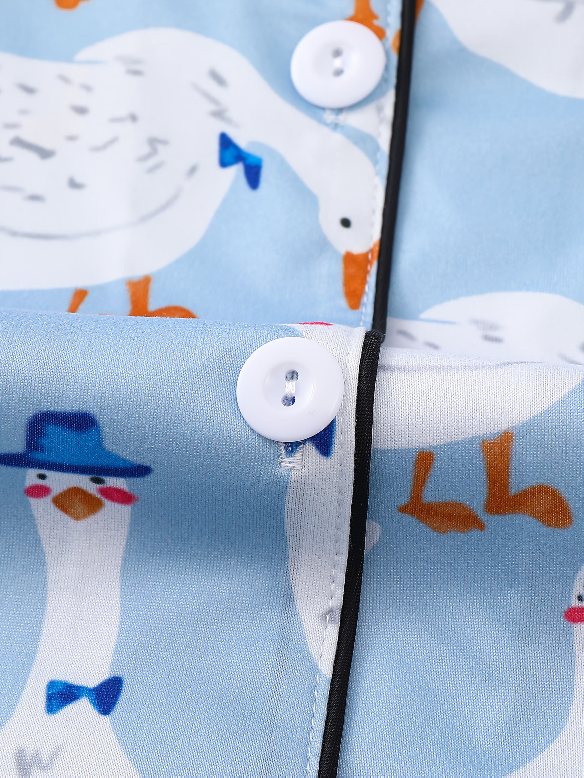 Light blue goose print satin-look pajama set with piped trim, short sleeve button top and elastic waist shorts in silky stretch fabric — 95% Polyester/5% Elastane