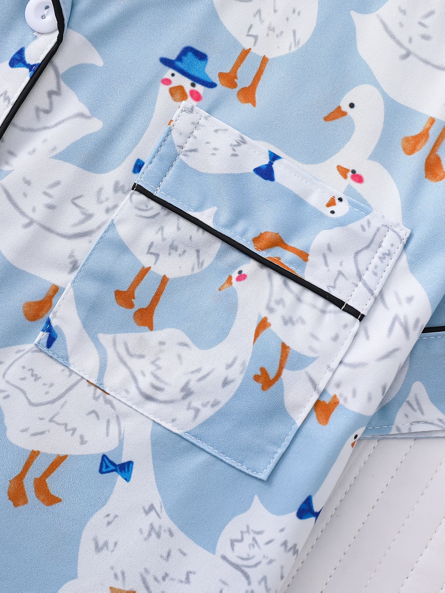 Light blue goose print satin-look pajama set with piped trim, short sleeve button top and elastic waist shorts in silky stretch fabric — 95% Polyester/5% Elastane