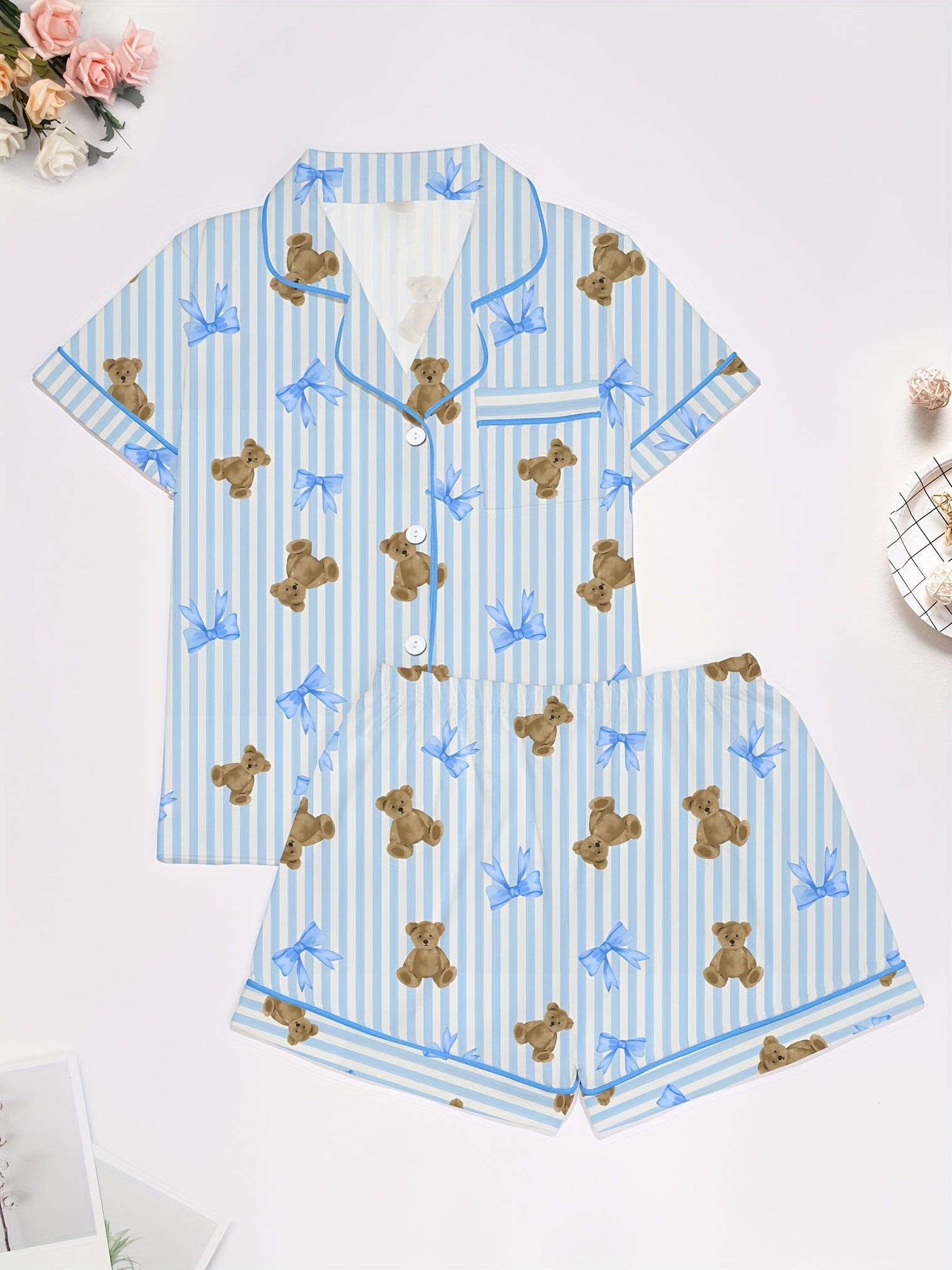 Light blue striped modal pajama set with teddy bear and bow print — short-sleeve button-up top and elastic waist shorts with piping