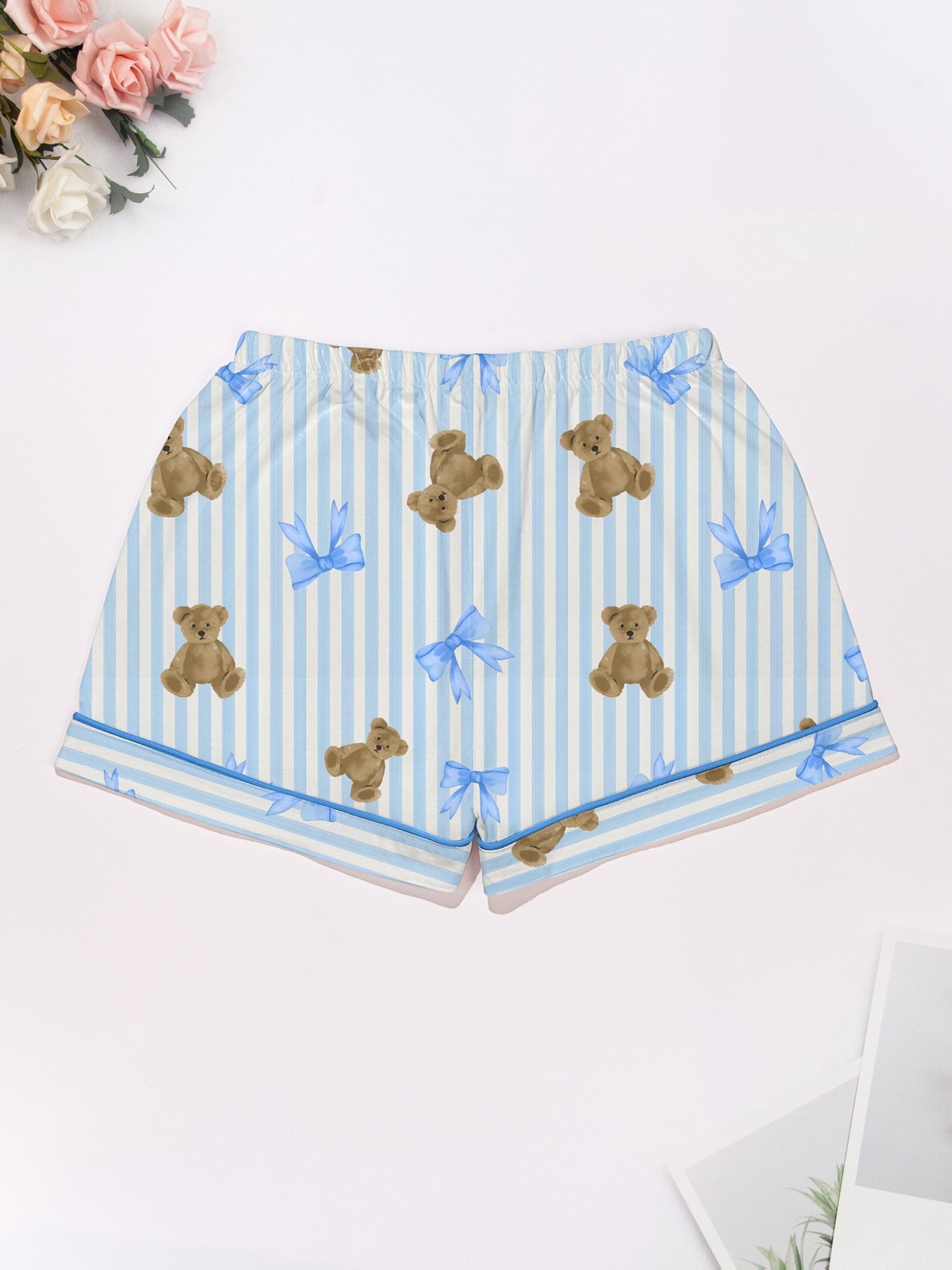 Light blue striped modal pajama set with teddy bear and bow print — short-sleeve button-up top and elastic waist shorts with piping