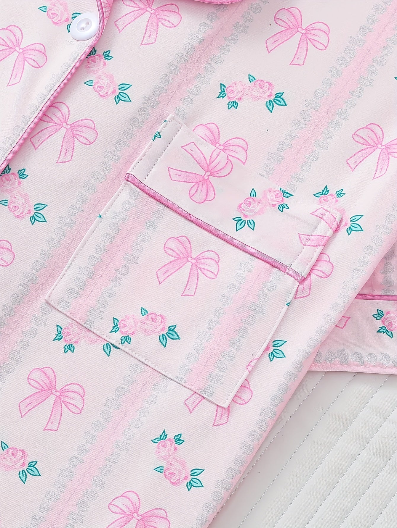 Blush satin-look short pajama set with pink ribbon and rose print, button-up short-sleeve top and elastic waist shorts, 95% Polyester/5% Elastane — lightweight and silky