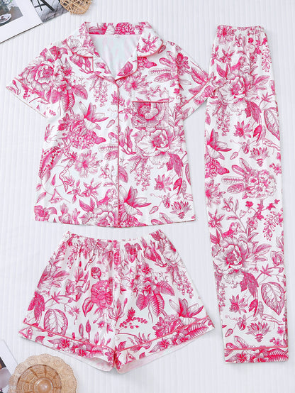 White satin-look pajama set with pink toile floral print — short-sleeve button-up top with chest pocket, elastic waist shorts and full-length pants, 95% Polyester/5% Elastane