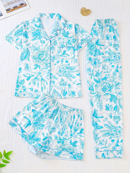 White satin-look pajama set with pink toile floral print — short-sleeve button-up top with chest pocket, elastic waist shorts and full-length pants, 95% Polyester/5% Elastane