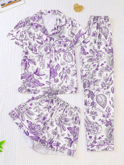 White satin-look pajama set with pink toile floral print — short-sleeve button-up top with chest pocket, elastic waist shorts and full-length pants, 95% Polyester/5% Elastane