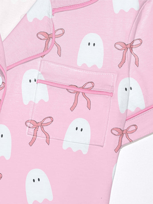 Pink cotton pajama set with white ghost and ribbon print — short sleeve notch collar top and elastic waist shorts