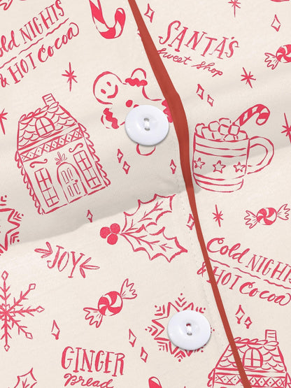 Cream short-sleeve women’s pajama set with red holiday sketch print of gingerbread houses, candy canes and cocoa mugs — short top and elastic waist shorts in 95% polyester 5% elastane
