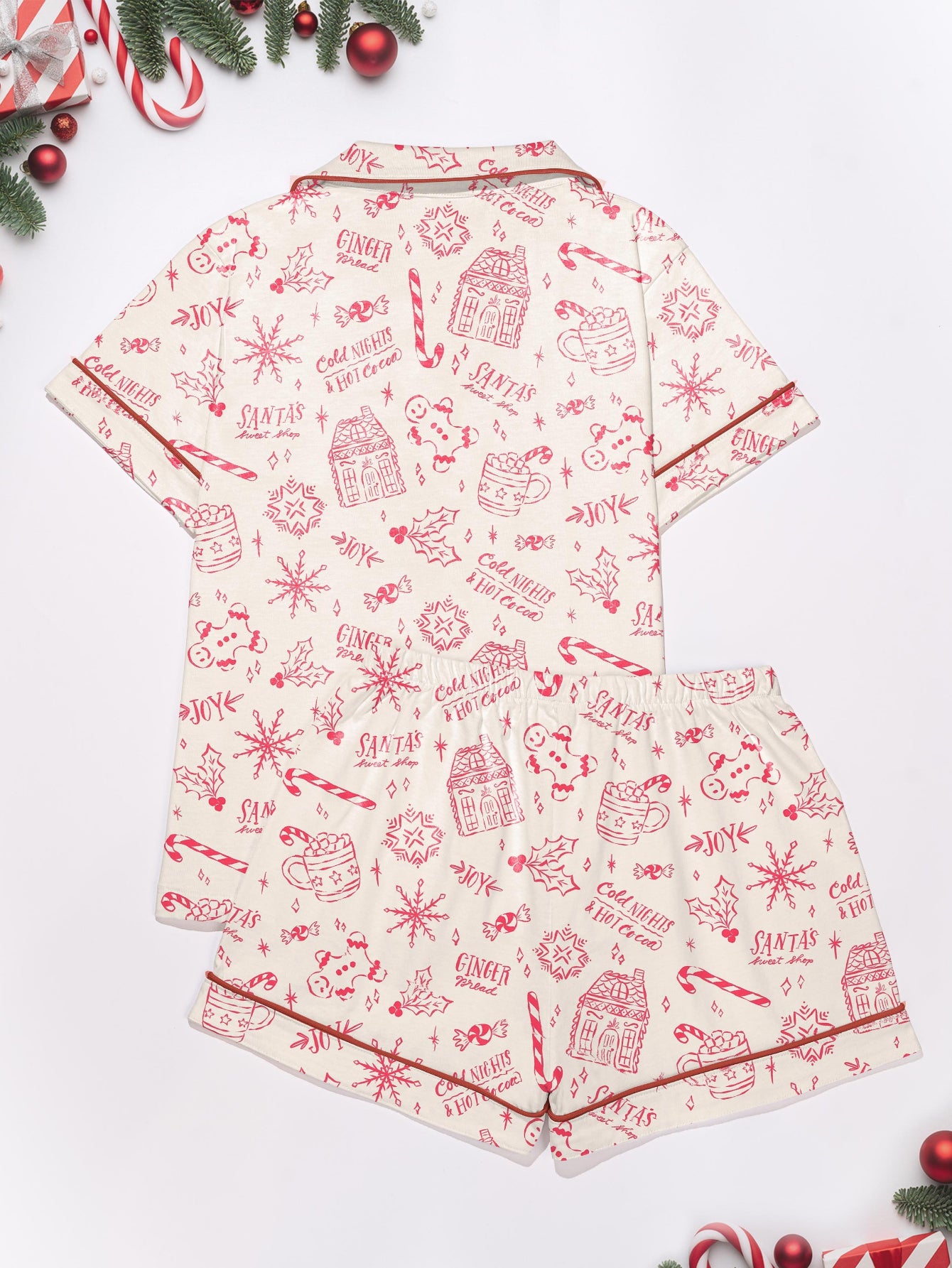 Cream short-sleeve women’s pajama set with red holiday sketch print of gingerbread houses, candy canes and cocoa mugs — short top and elastic waist shorts in 95% polyester 5% elastane