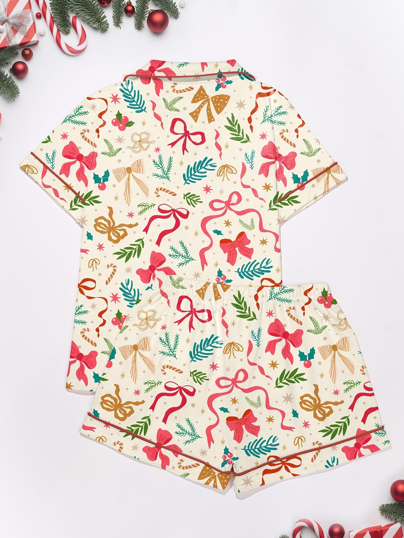 Cream cotton short-sleeve pajama set with pink and gold ribbon and greenery print — button-up top and elastic waist shorts with contrast piping