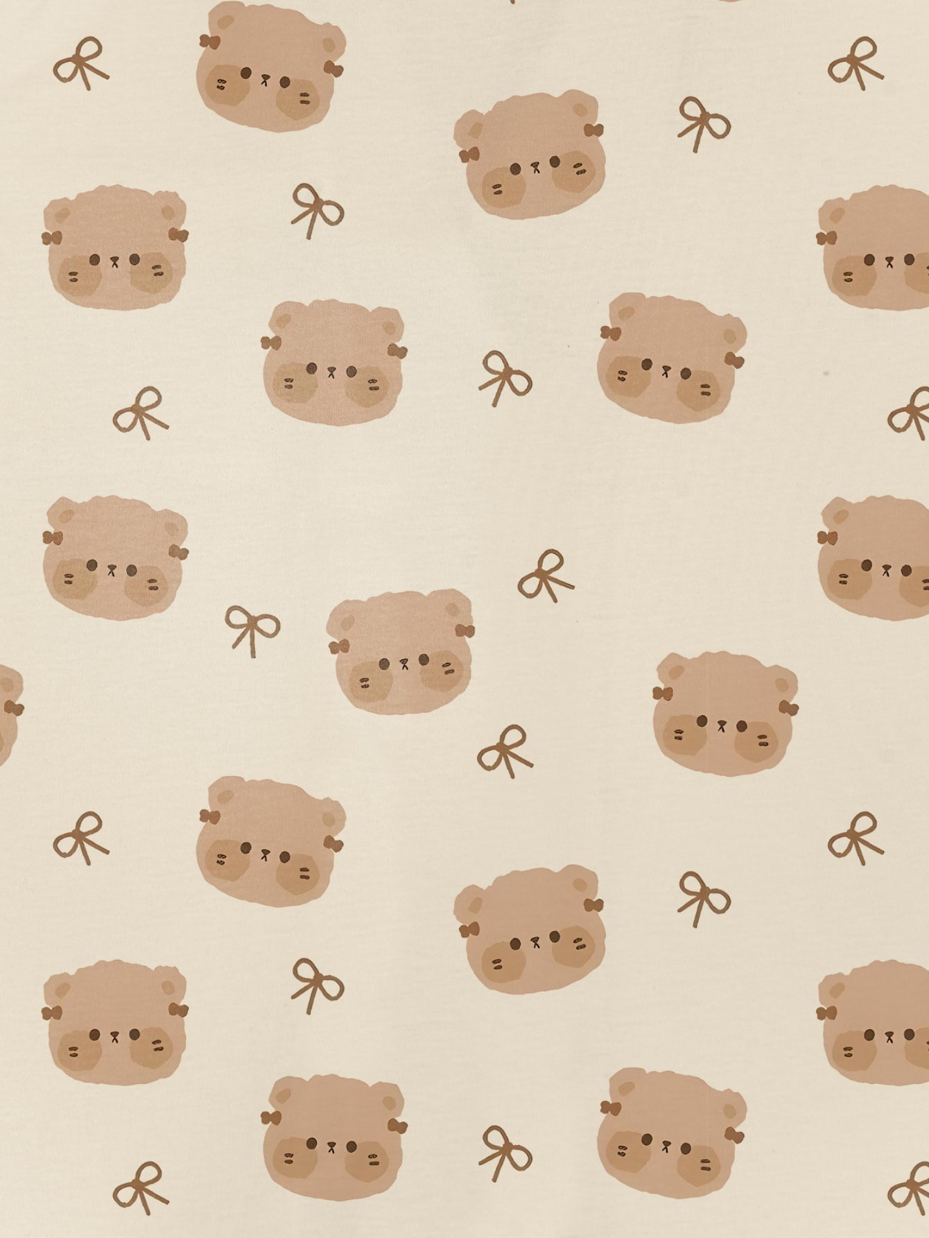 Cream short‑sleeve modal pajama set with teddy face and bow print — button‑up top and elastic waist shorts with piping