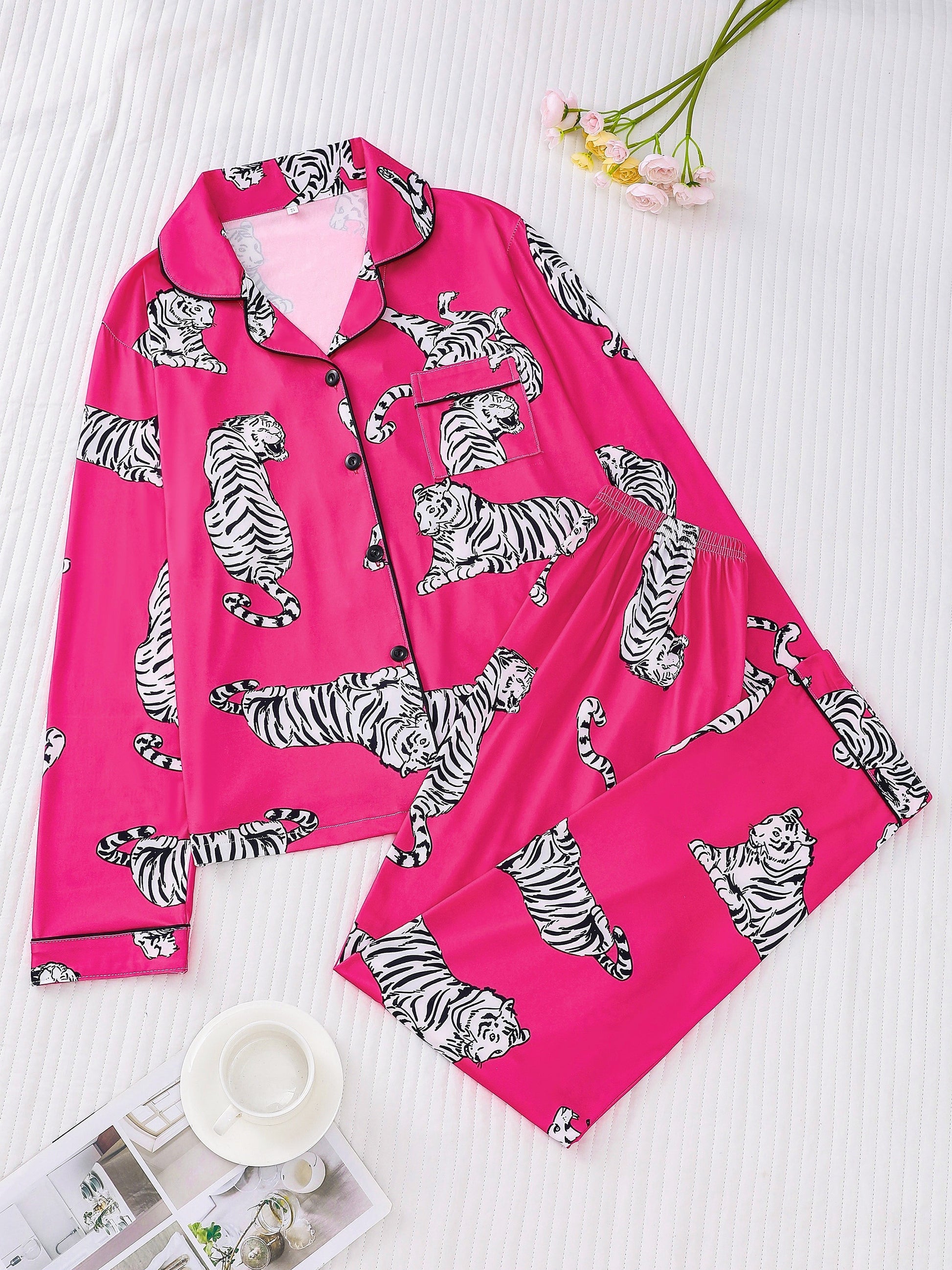 Fuchsia satin-look pajama set with white-and-black tiger print — long-sleeve button-up top with chest pocket and elastic waist pants, 95% Polyester/5% Elastane