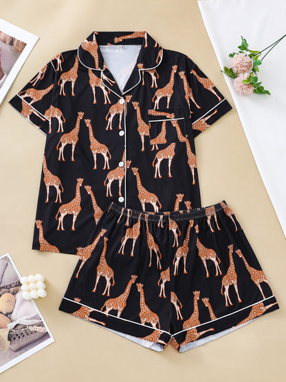 Hot satin-look pajama set with black-and-white giraffe print — short-sleeve button-up top with chest pocket and elastic waist shorts, 95% Polyester/5% Elastane