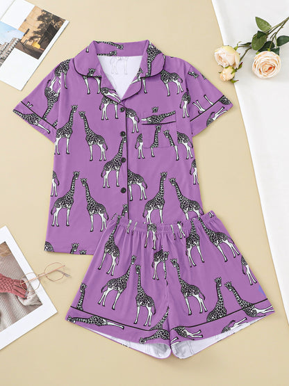 Hot satin-look pajama set with black-and-white giraffe print — short-sleeve button-up top with chest pocket and elastic waist shorts, 95% Polyester/5% Elastane