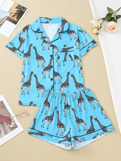 Hot satin-look pajama set with black-and-white giraffe print — short-sleeve button-up top with chest pocket and elastic waist shorts, 95% Polyester/5% Elastane