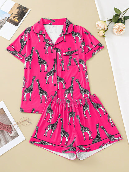 Hot satin-look pajama set with black-and-white giraffe print — short-sleeve button-up top with chest pocket and elastic waist shorts, 95% Polyester/5% Elastane