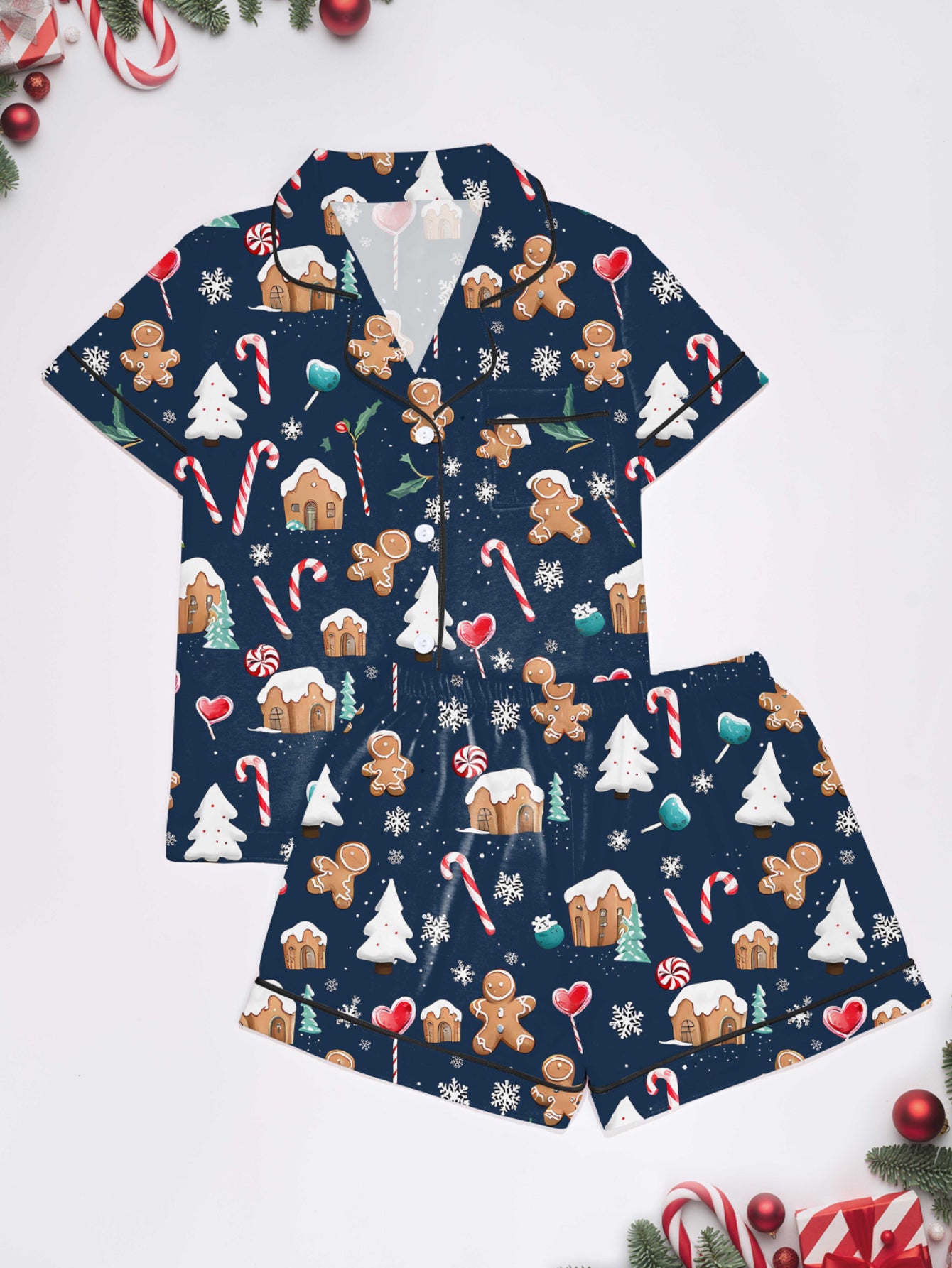 Navy modal pajama set with gingerbread men, candy canes and cottages print — short‑sleeve button top and elastic waist shorts with piping