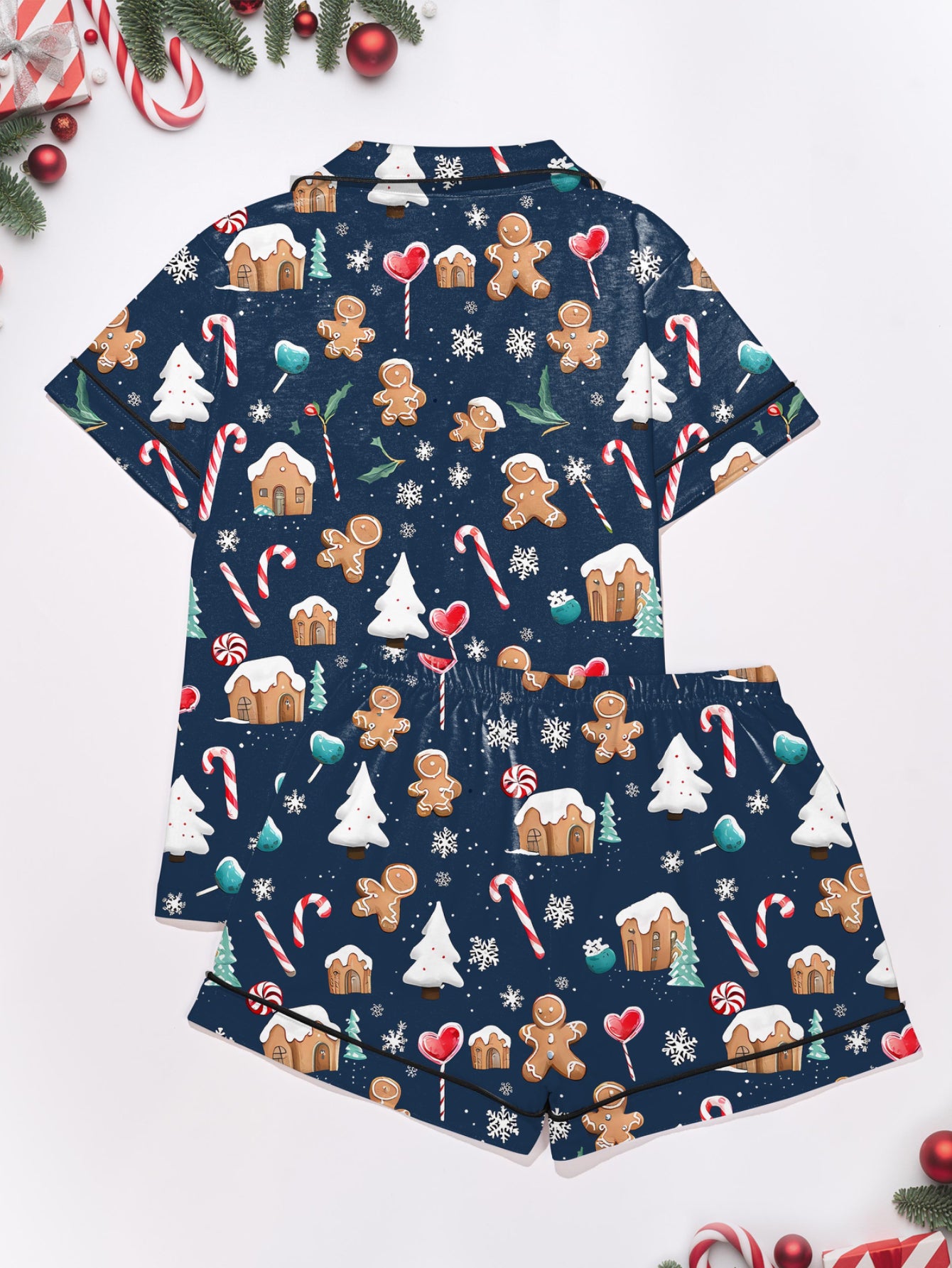 Navy modal pajama set with gingerbread men, candy canes and cottages print — short‑sleeve button top and elastic waist shorts with piping