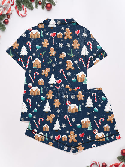 Navy modal pajama set with gingerbread men, candy canes and cottages print — short‑sleeve button top and elastic waist shorts with piping