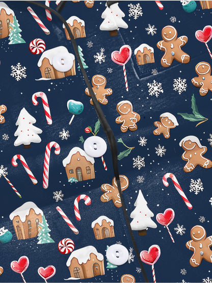 Navy modal pajama set with gingerbread men, candy canes and cottages print — short‑sleeve button top and elastic waist shorts with piping