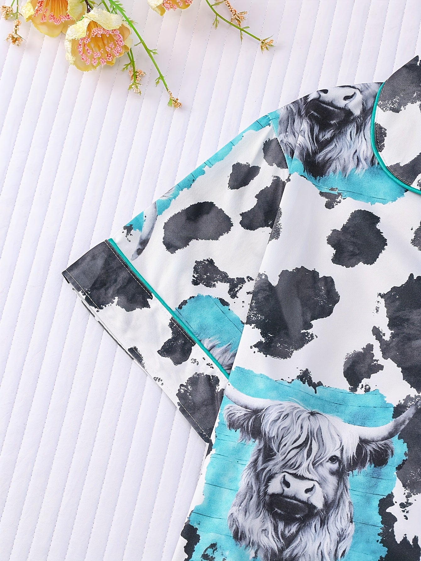 Cream satin-look short pajama set with highland cow portrait and cowhide splatter print — short-sleeve relaxed top and elastic waist shorts, 95% Polyester/5% Elastane, lightweight and breathable