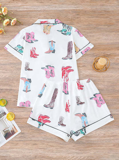 Ivory satin-look pajama set with colorful cowboy-boot print — short-sleeve button-up top with chest pocket and elastic waist shorts, 95% Polyester/5% Elastane