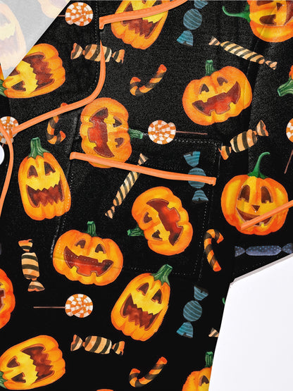 Black modal pajama set with orange jack‑o’lanterns and candy print — short sleeve button top and elastic waist shorts with piping