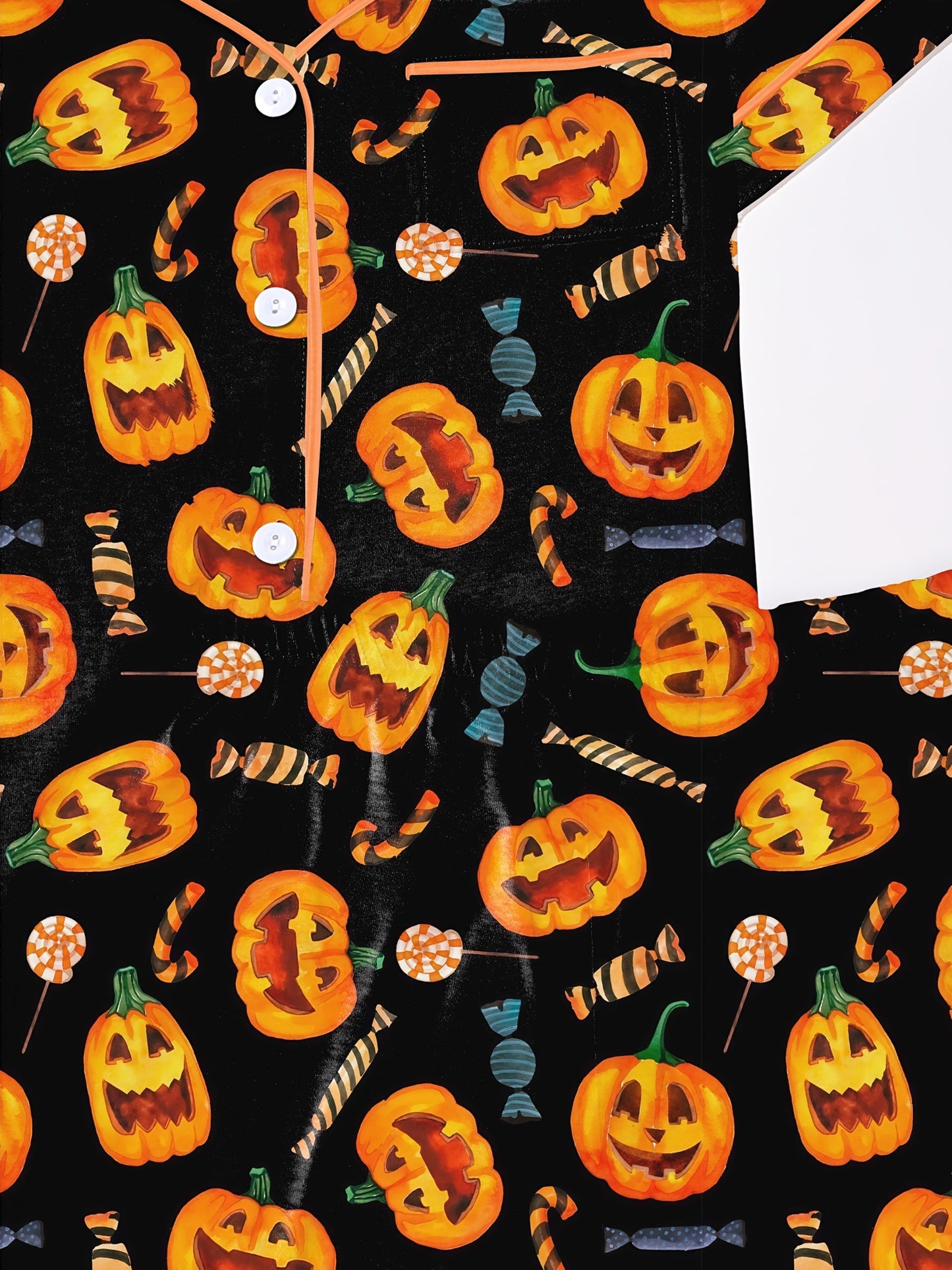 Black modal pajama set with orange jack‑o’lanterns and candy print — short sleeve button top and elastic waist shorts with piping