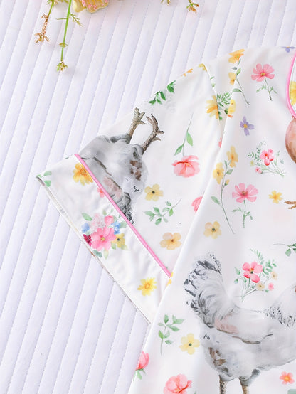 Cream satin-look pajama set with hen and floral print — short-sleeve button-up top with chest pocket and elastic waist shorts, 95% Polyester/5% Elastane