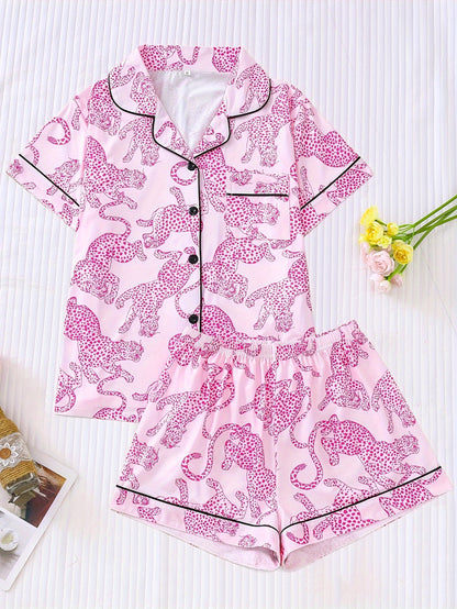 White satin-look pajama set with black cheetah print — short-sleeve button-up top with chest pocket and elastic waist shorts, 95% Polyester/5% Elastane