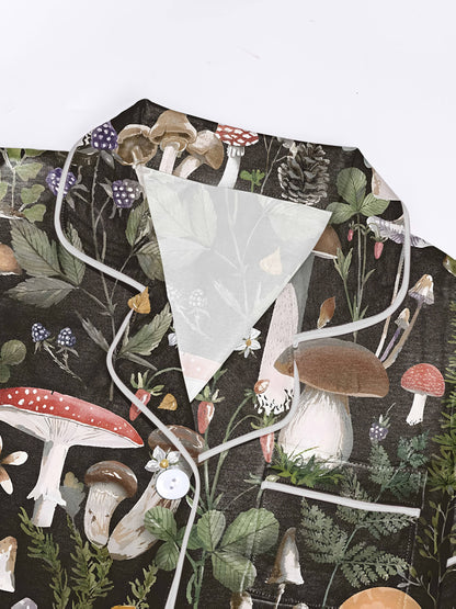 Dark charcoal mushroom watercolor print modal pajama set — short‑sleeve button top and elastic waist shorts with piping