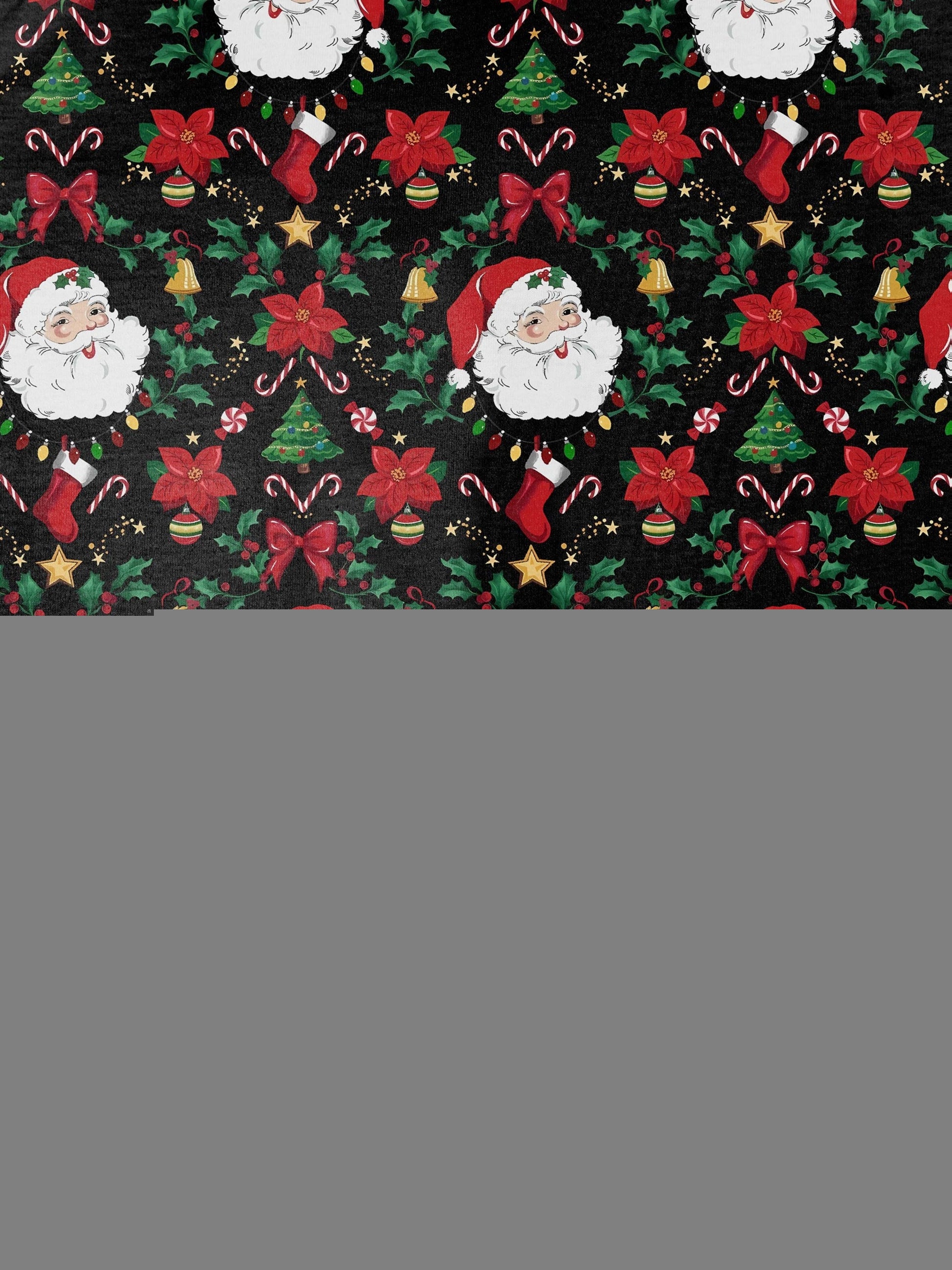 Woman wearing black short-sleeve pajama set with Santa, poinsettia and candy cane print — button-up top and elastic waist shorts with red piping
