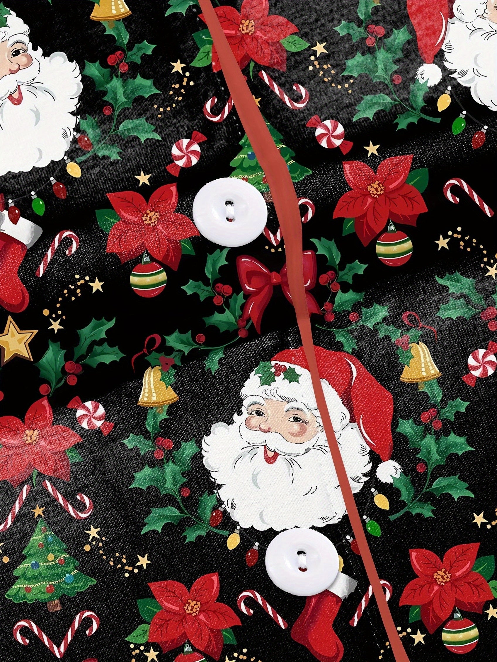 Woman wearing black short-sleeve pajama set with Santa, poinsettia and candy cane print — button-up top and elastic waist shorts with red piping