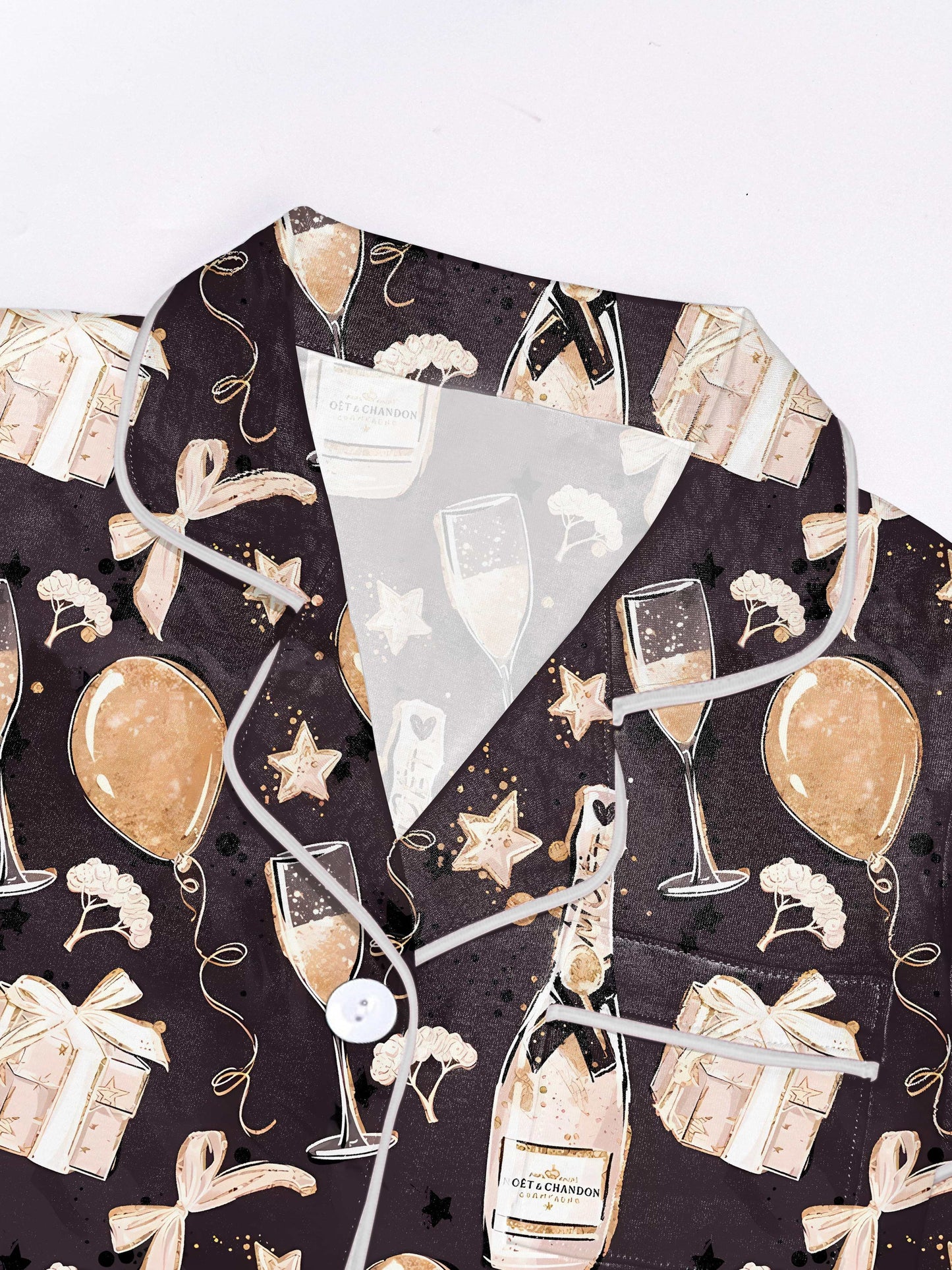 Dark modal pajama set with champagne flutes, balloons and gift box motifs — short‑sleeve button top and elastic waist shorts with contrast piping